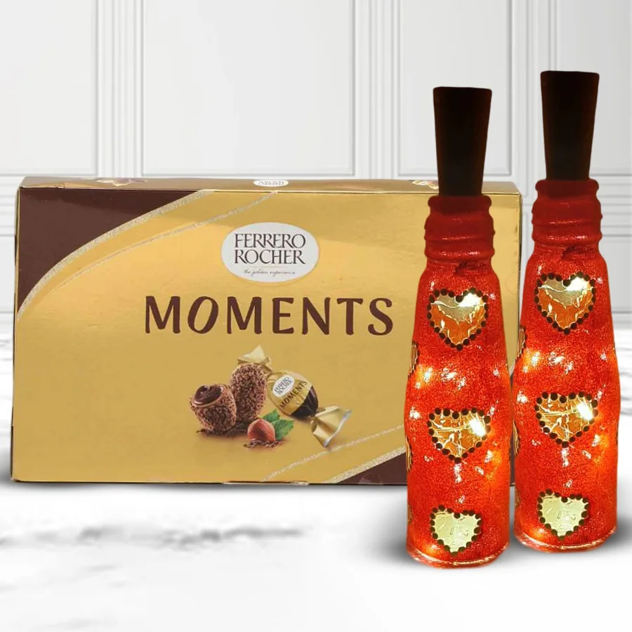 Twin Heart Glow Handmade LED Lamp next to a box of 12 Ferrero Rocher chocolates, creating a romantic Valentine's Day gift combo.