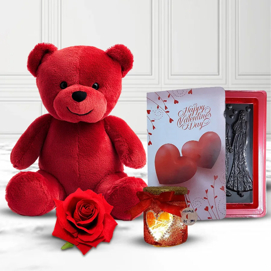 Lovely Valentine’s gift combo featuring a red teddy bear, a personalized LED lamp, love book chocolates, and a red velvet rose.