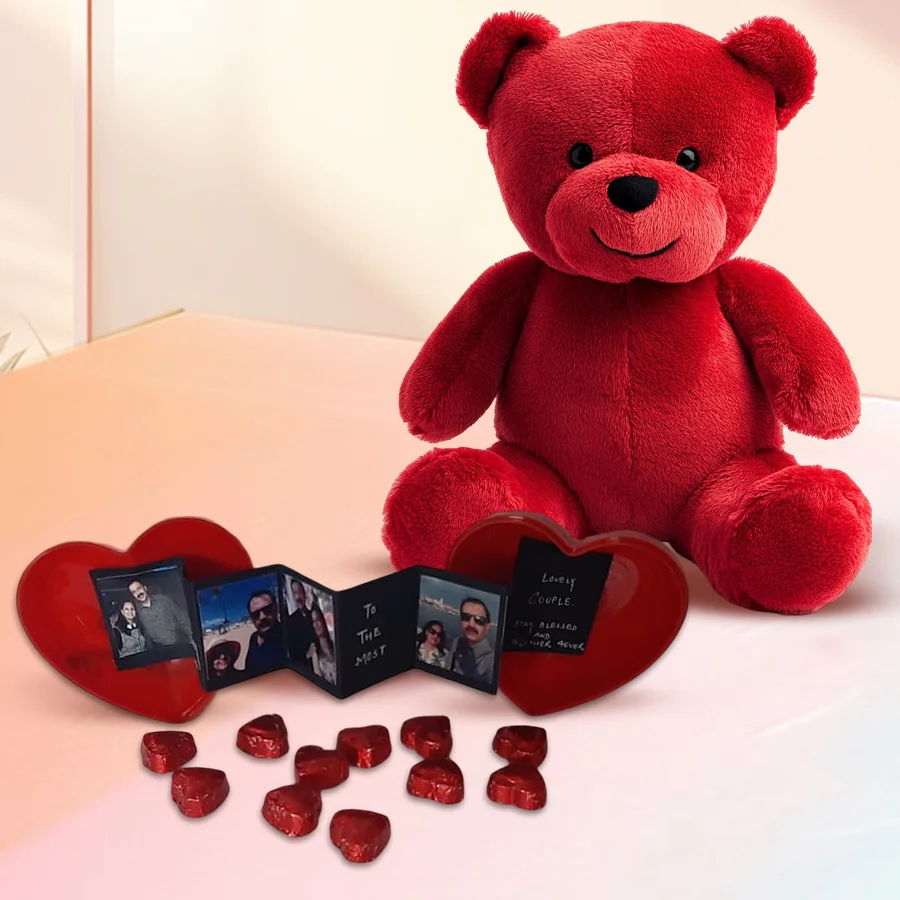 Red teddy bear with a heart-shaped personalized box containing chocolates and photos for Valentine's Day gift
