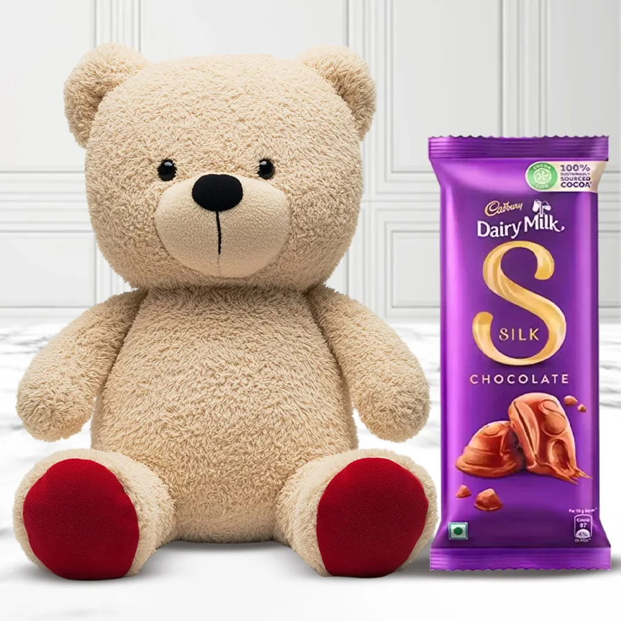 Cute 12-inch teddy bear cuddling a Cadbury Silk bar, showcasing a charming Valentine's Day gift.