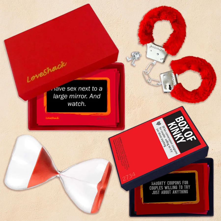 Intimate Adult Game Duo for Valentine's Day featuring handcuffs, love timer, and game boxes in a romantic setting