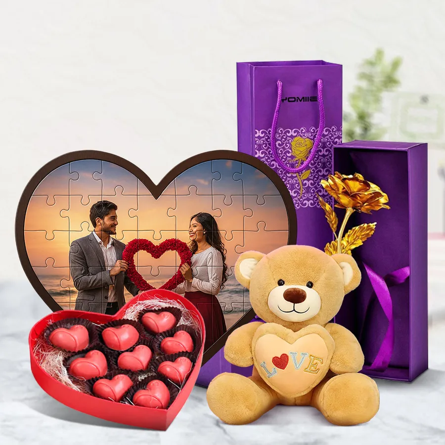 Mesmerizing Personalized Gift Combo featuring a heart-shaped puzzle, golden rose, handmade chocolate box with heart cutout, and a 6-inch teddy bear arranged beautifully.