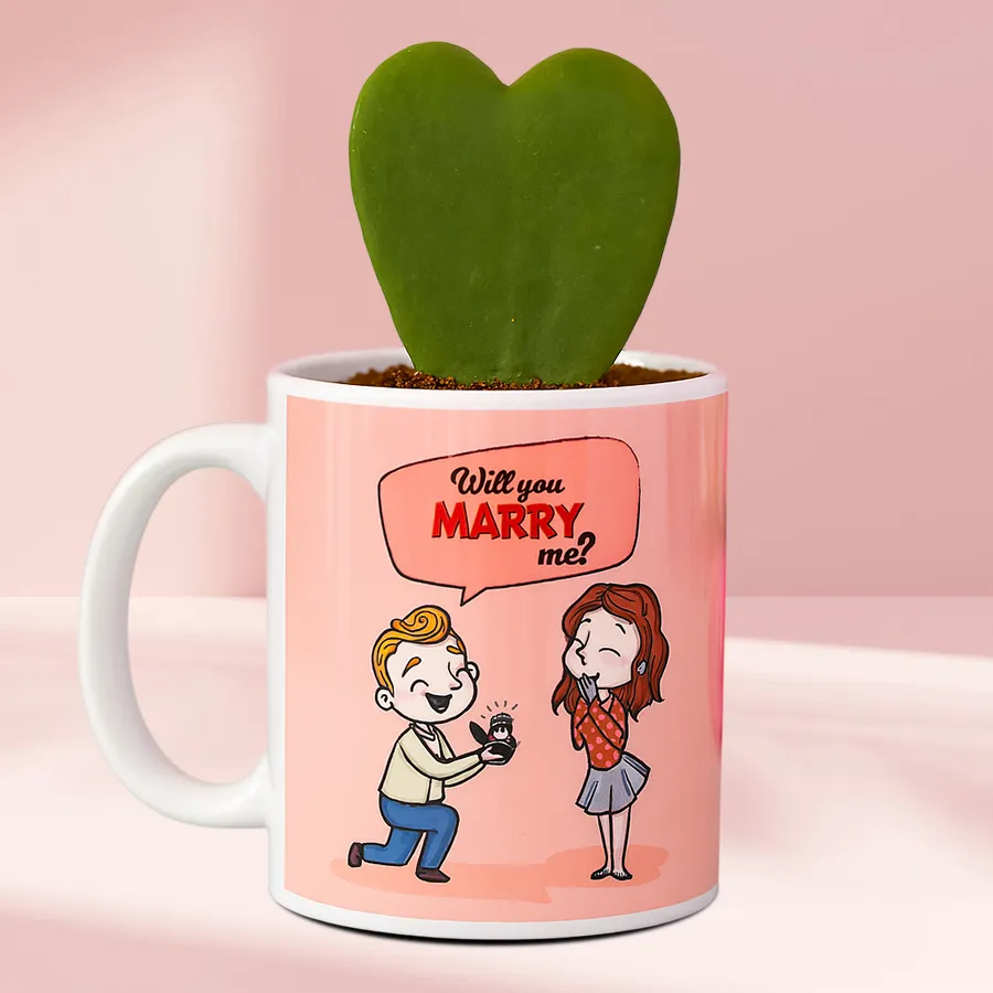 Hoya Heart Plant in a personalized coffee mug with a vibrant green heart-shaped leaf
