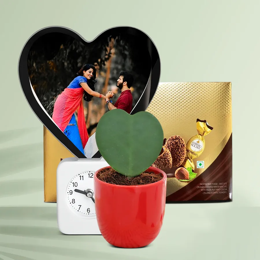 Marvelous Personalized Gift Hamper for Women's Day featuring a personalized magic heart lamp clock, a Hoya heart plant, and Ferrero Rocher chocolates.