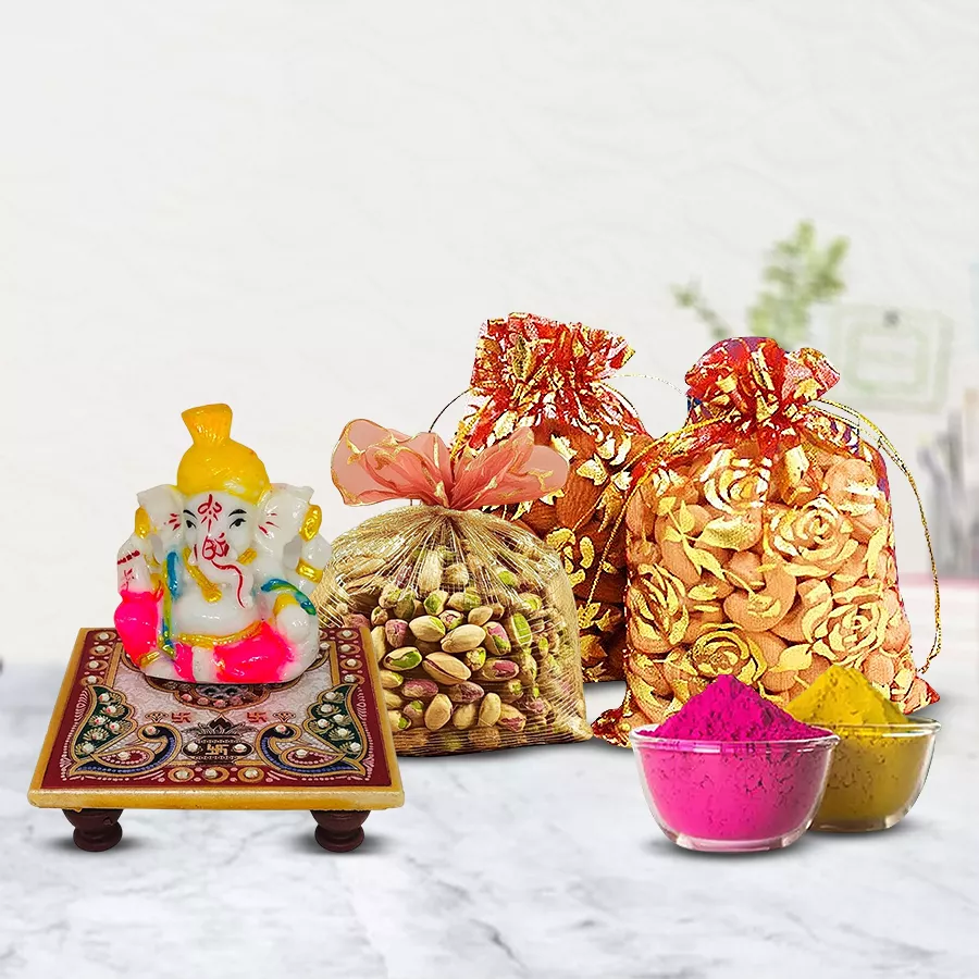 Marble Ganesha statue with dry fruits in potlis and organic herbal gulal for Holi celebration