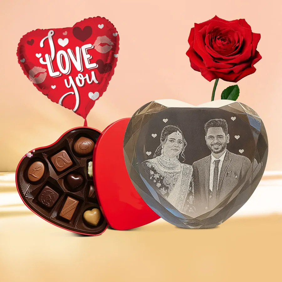 Mesmerizing Personalized Gift Set including a custom Heart Shape Sub Crystal, a red rose, an "I Love You" Mylar balloon, and a Heart Shape Tin filled with 11 handmade chocolates.