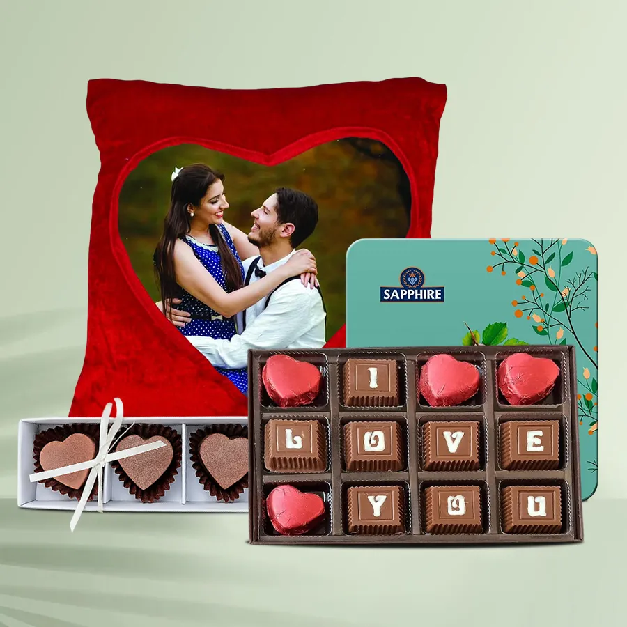 Personalized gift combo featuring a velvet cushion, sapphire chocolates, SMS chocolates, and heart-shaped chocolates for a girlfriend.
