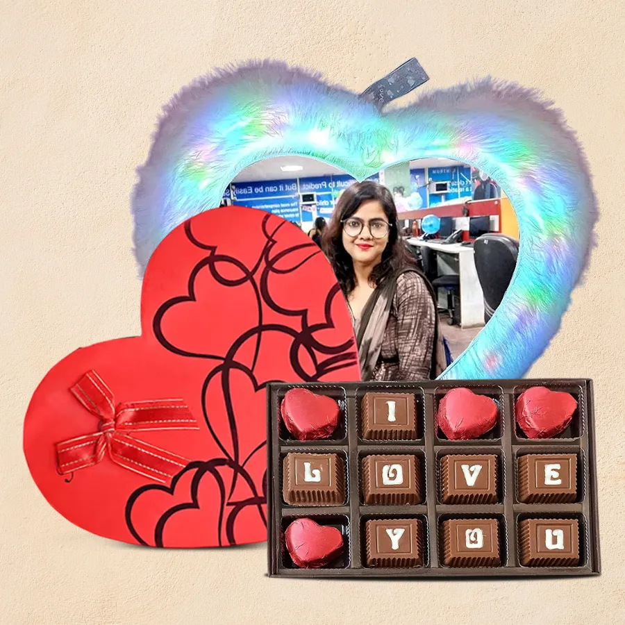 Personalized LED heart-shaped cushion with fur texture, accompanied by a tin box of 11 handmade chocolates, including a special "I Love You" chocolate.