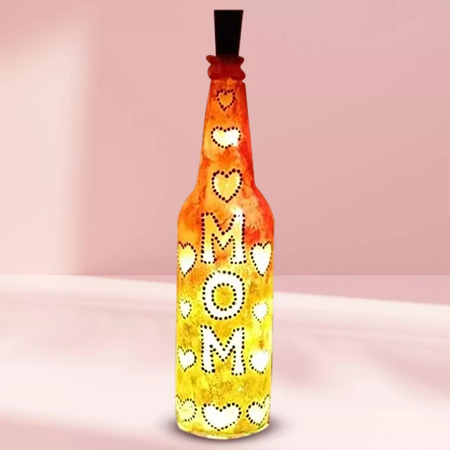 Elegantly handcrafted LED bottle lamp designed as a gift for mom, featuring a warm glow in a charming setup.