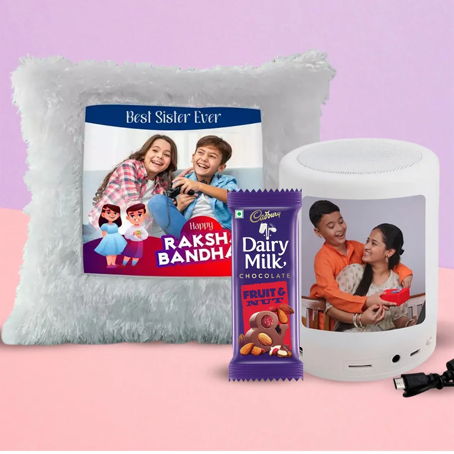 Cool LED light cushion with personalized Bluetooth speaker and Cadbury Dairy Milk Fruit & Nut bar, perfect gift for Rakshabandhan.