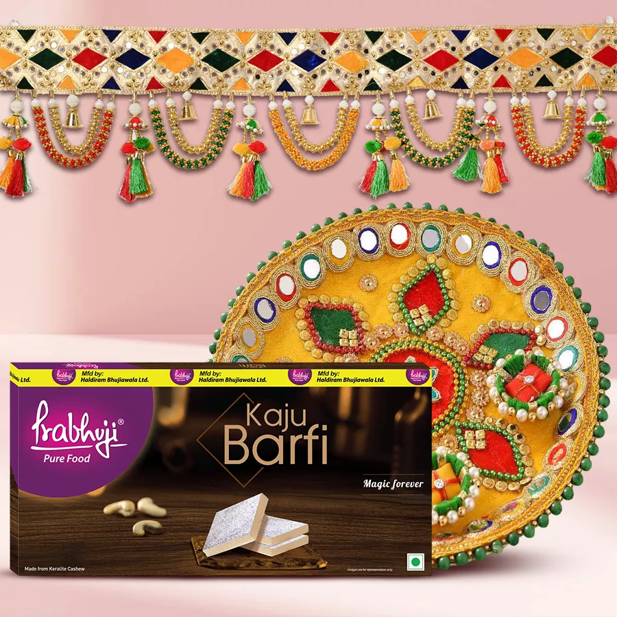 Tempting Haldiram Sweets and Decorative Bandhanwar Combo featuring Kaju Barfi, Multicolored Bandhanwar, and Designer Steel Thali for Diwali celebrations.