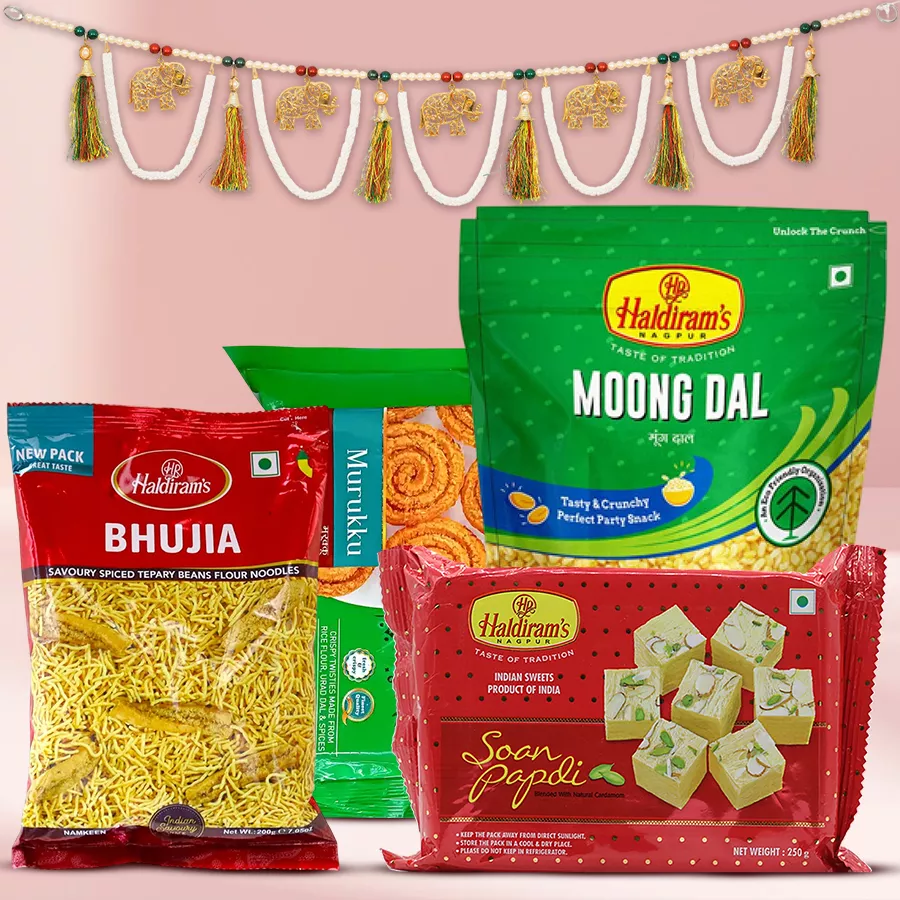 Beautiful Toran with Haldiram sweets and snacks in colorful packaging for Diwali celebrations