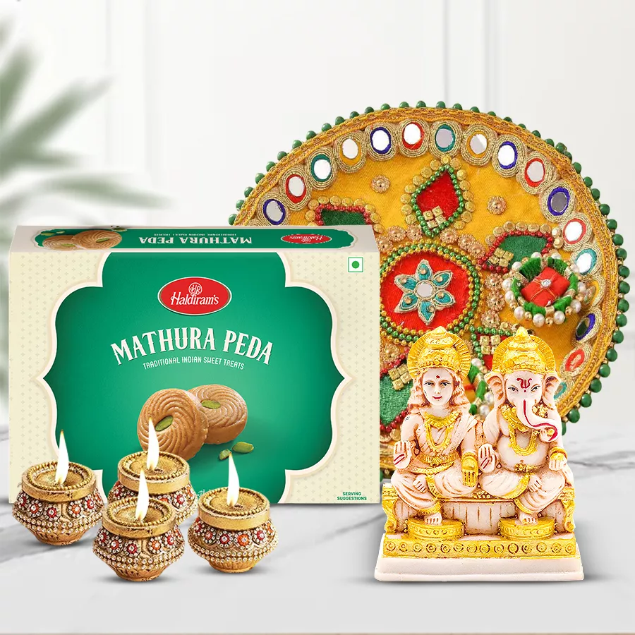 Exquisite Diwali Celebration Gift Assortments featuring Haldiram Mathura Pedha, Laxmi-Ganesh idols, terracotta diyas, and a designer steel thali.