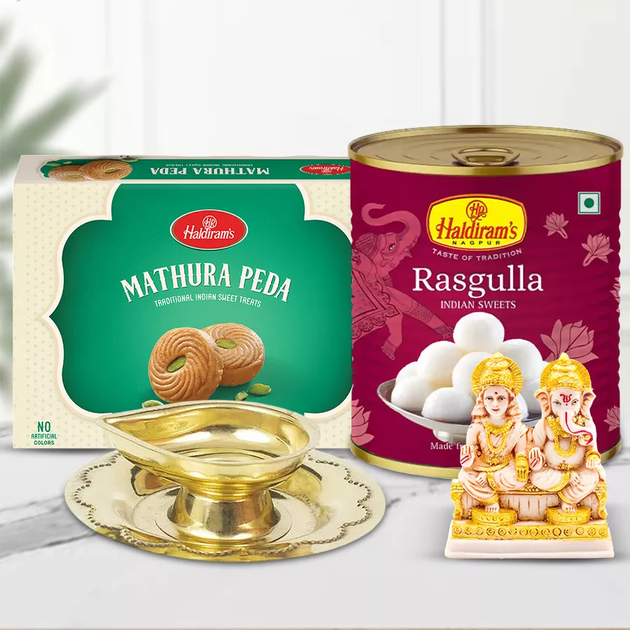 Sublime Lord Idol Haldiram Sweets and Brass Lamp Diwali Gift Combo featuring Mathura Pedha, Rasgulla, Laxmi Ganesh idol, and handcrafted brass diya.