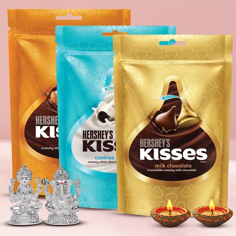 Hershey's Kisses gift pack for Diwali featuring Cookies 'n' Creme, Almond, and Milk Chocolate flavors, decorated with a Laxmi Ganesh idol and elegant Diyas.