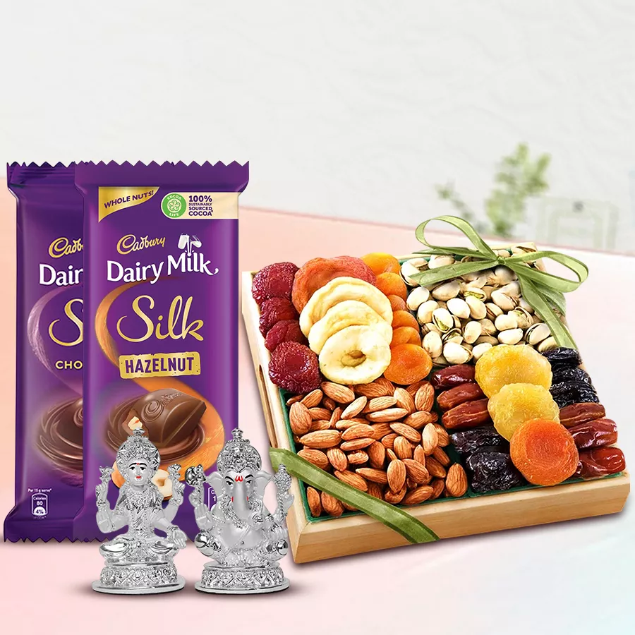 Gift combo featuring dry fruits, Cadbury chocolates, Laxmi Ganesh idol, and a wooden tray for Diwali celebrations