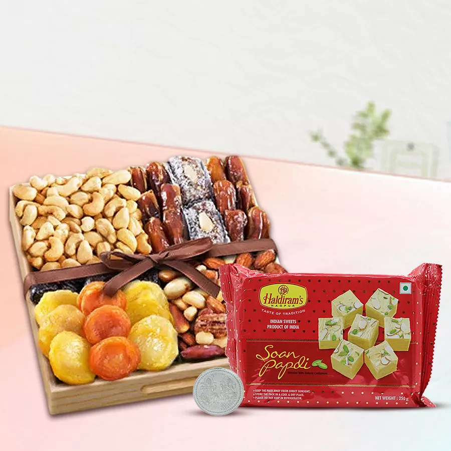 Blissful Haldiram Soan Papdi and dry fruits hamper with Laxmi Ganesh silver-plated coin in wooden tray