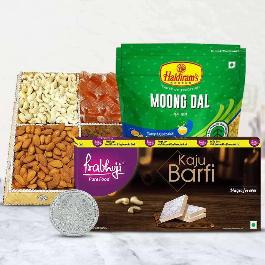 Haldiram Snacks and Sweets hamper with dry fruits and a silver-plated Laxmi Ganesh coin in a sturdy cardboard tray