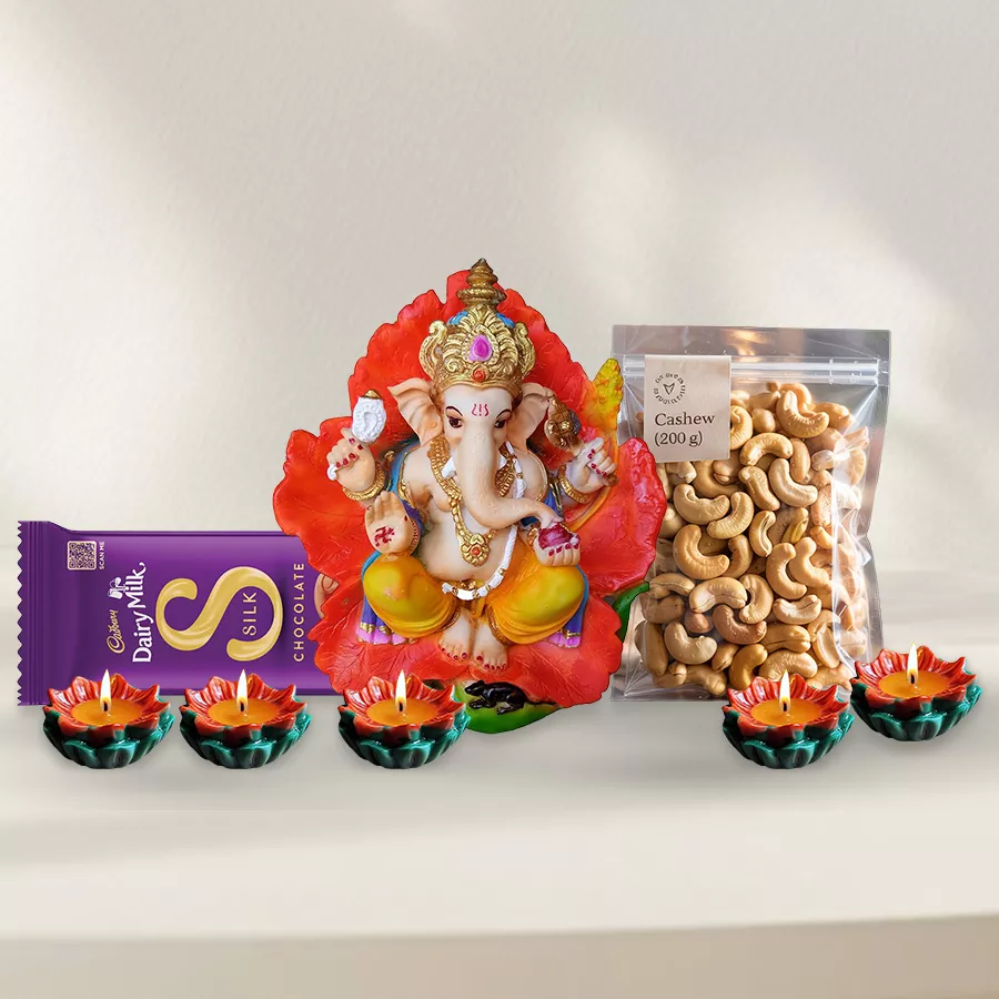 Exquisite Festive Selection Gift Combo including Cadbury Dairy Milk Silk Chocolate Bar, premium cashews, Vighnesh Ganesh Idol, and Matka Wax Diyas