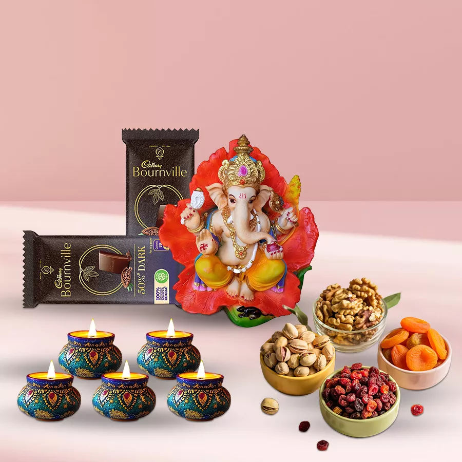 Nutty Dry Fruits and Yummy Chocolates Combo for Deepavali celebration with pistachios, walnuts, dried apricots, cranberries, Cadbury Bournville chocolates, Vighnesh Ganesh idol, and matka wax diyas.