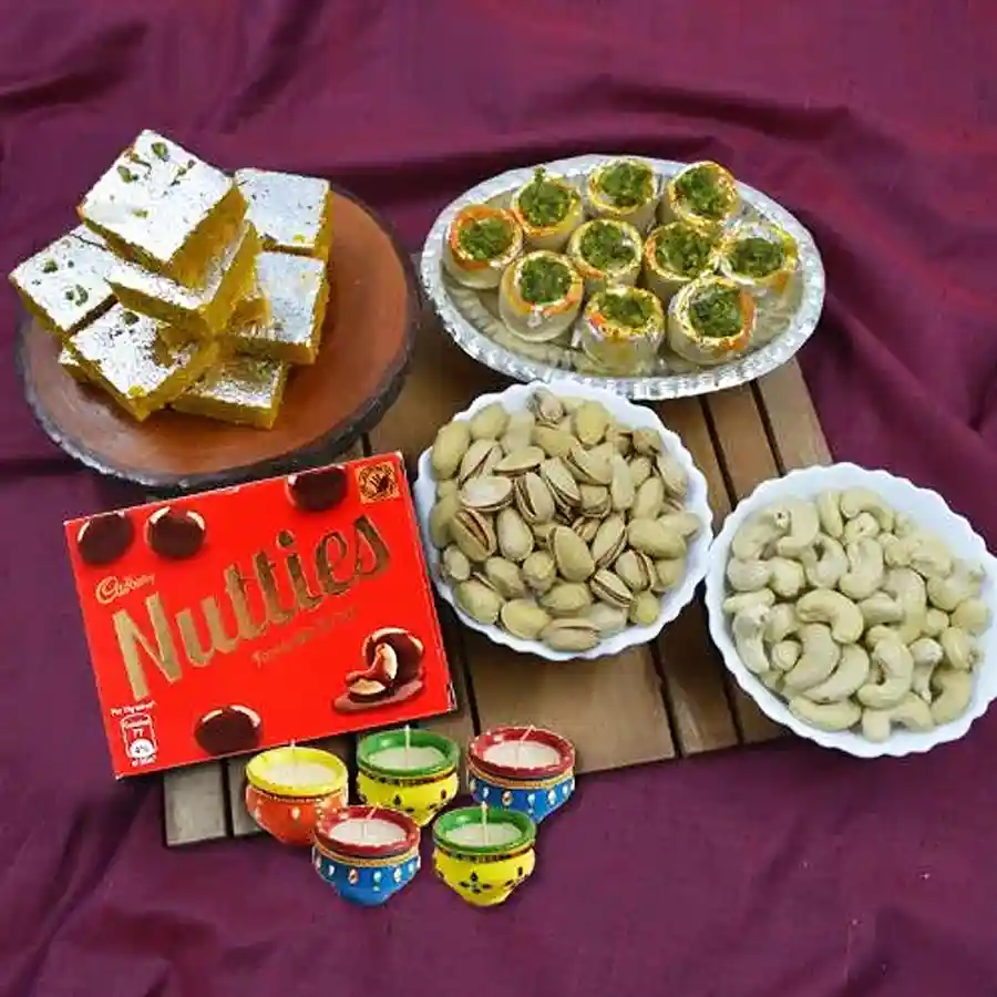 Tasty Haldiram Mithai and Dry Fruits Combo with Nutties and Wax Diyas for Diwali celebration