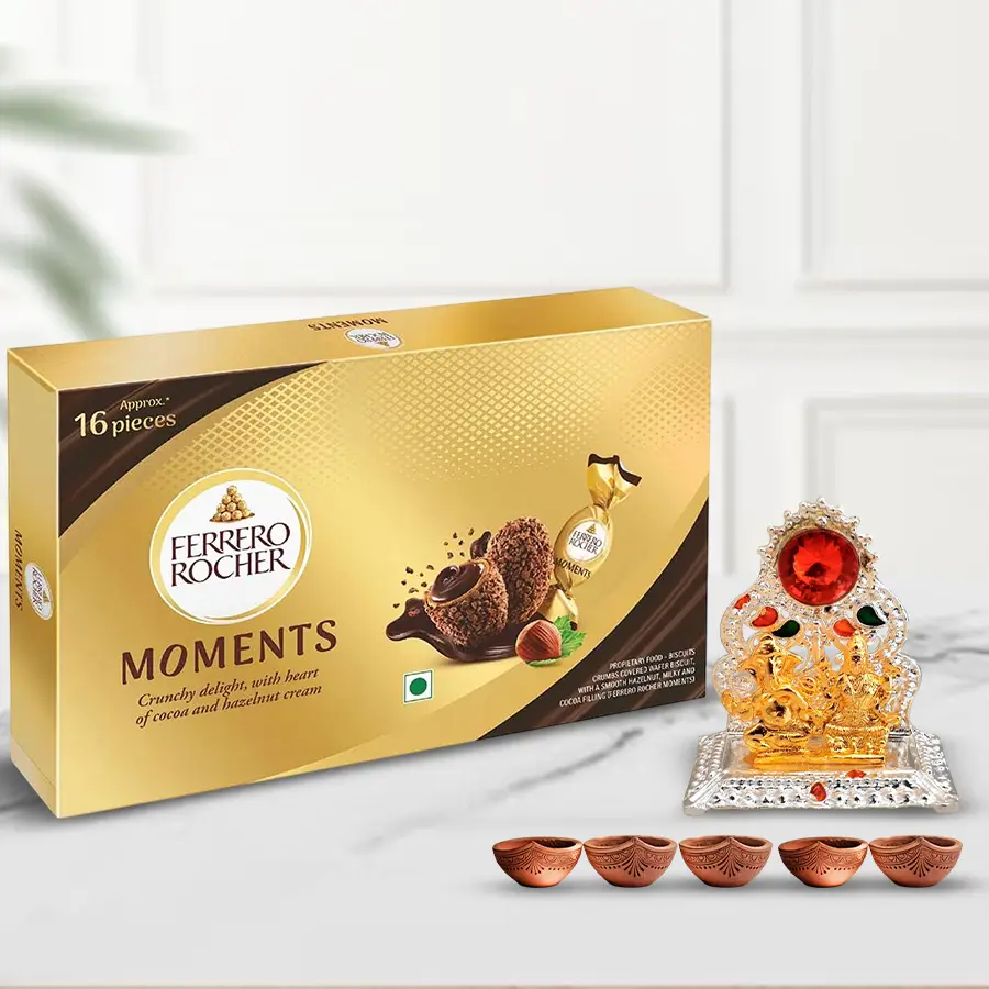 Delicious Ferrero Rocher chocolates with a Ganesh Lakshmi Mandap and elegant mud diyas for Diwali celebrations.