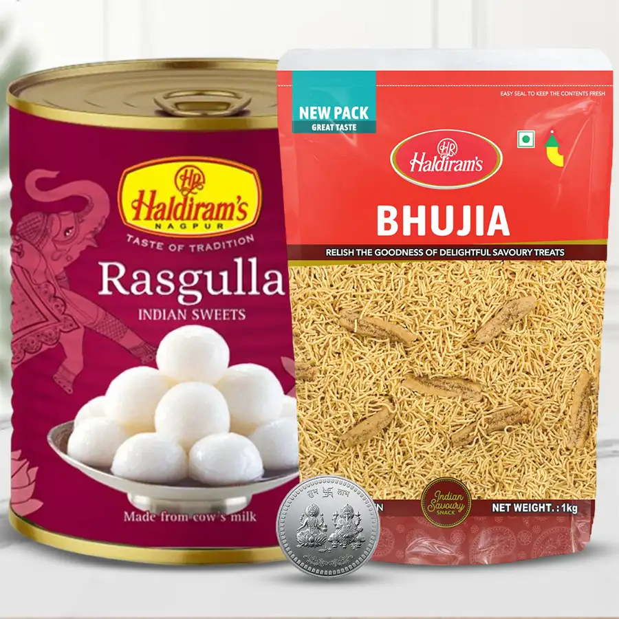 Lovely Haldiram Sweets and Snacks Combo for Diwali featuring Rasogula, Bhujiya, and a Silver Plated Ganesh Lakshmi Coin.