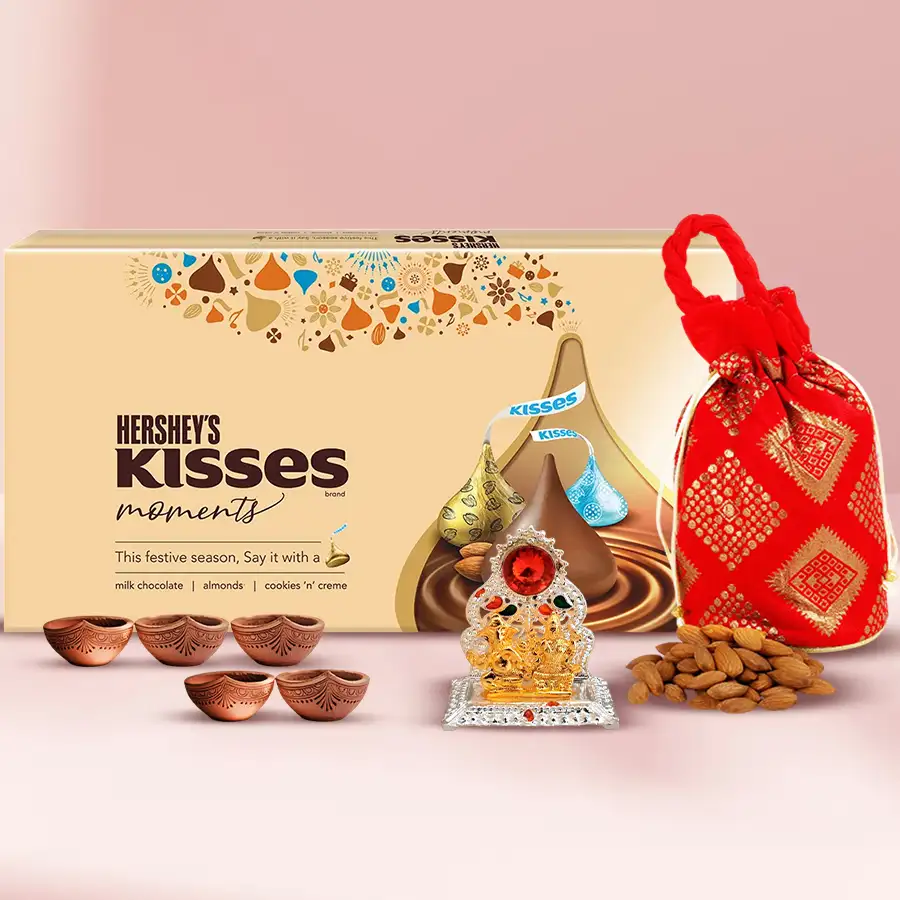 Gift set featuring Hershey's Kisses, almond potli, Ganesh-Laxmi mandap, and five Matka Diyas for Deepavali celebrations.