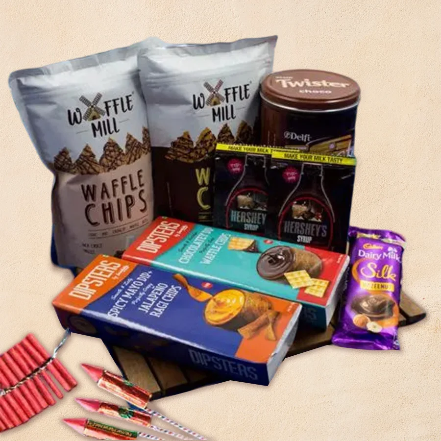 A beautifully arranged wooden gift tray filled with Cadbury Dairy Milk Silk hazelnut bars, Hershey’s chocolate syrup, Waffle Mill chocolate chips, and Dipsters’ jalapeno chocolatey waffle chips, perfect for Diwali celebrations.