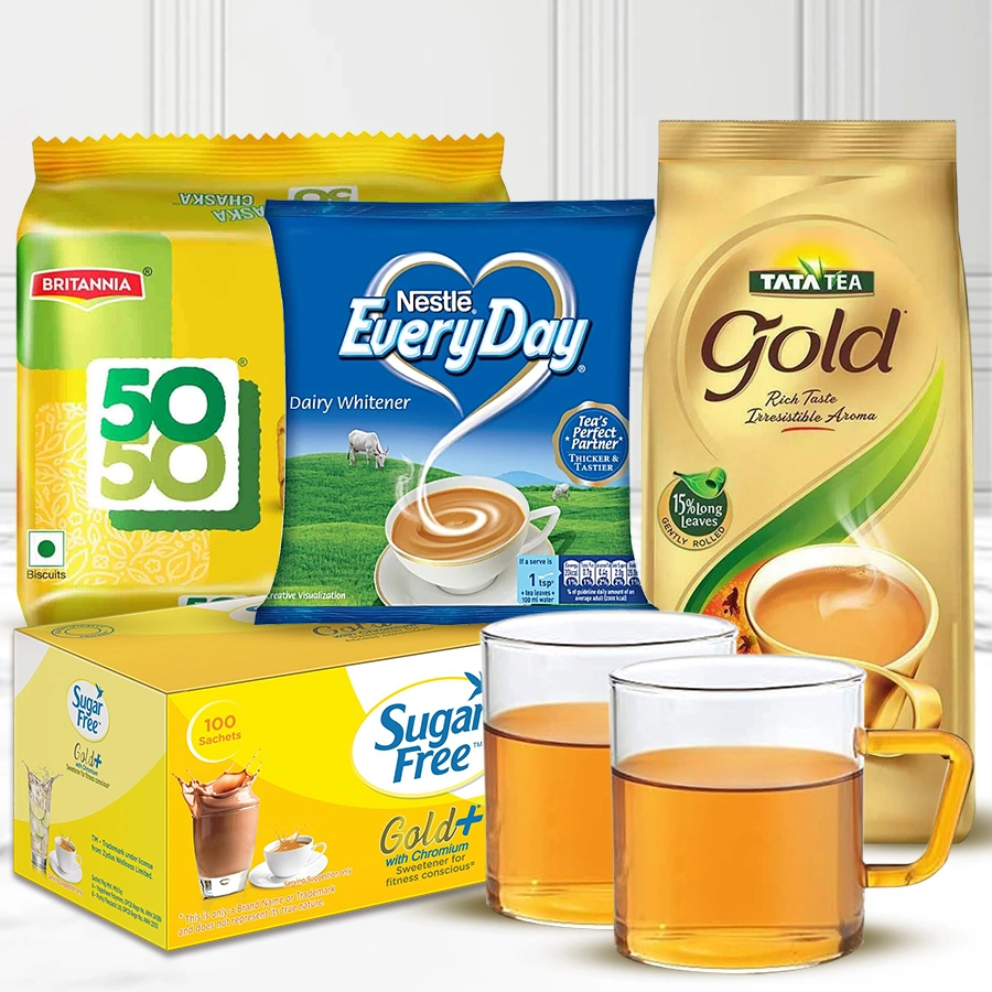 Fabulous Tea Hamper for Christmas featuring Tata Tea Gold, Nestle Everyday Dairy Whitener, Britannia Maska Chaska biscuits, Sugarfree Gold sweetener, and two Borosil Vision glass mugs.