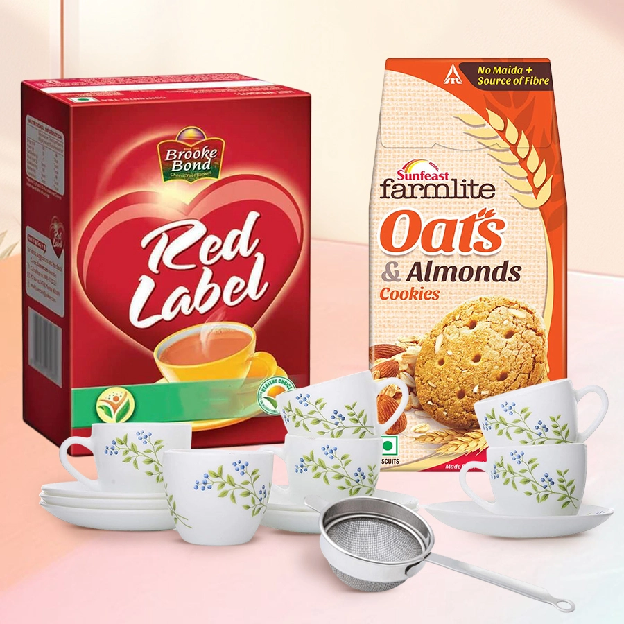 Superb Xmas Tea Hamper featuring La Opala Cup and Saucer Set of 6, Red Label Brooke Bond Tea, Sunfeast Farmlite Active Oats with Almonds Biscuits, and stainless steel strainer.