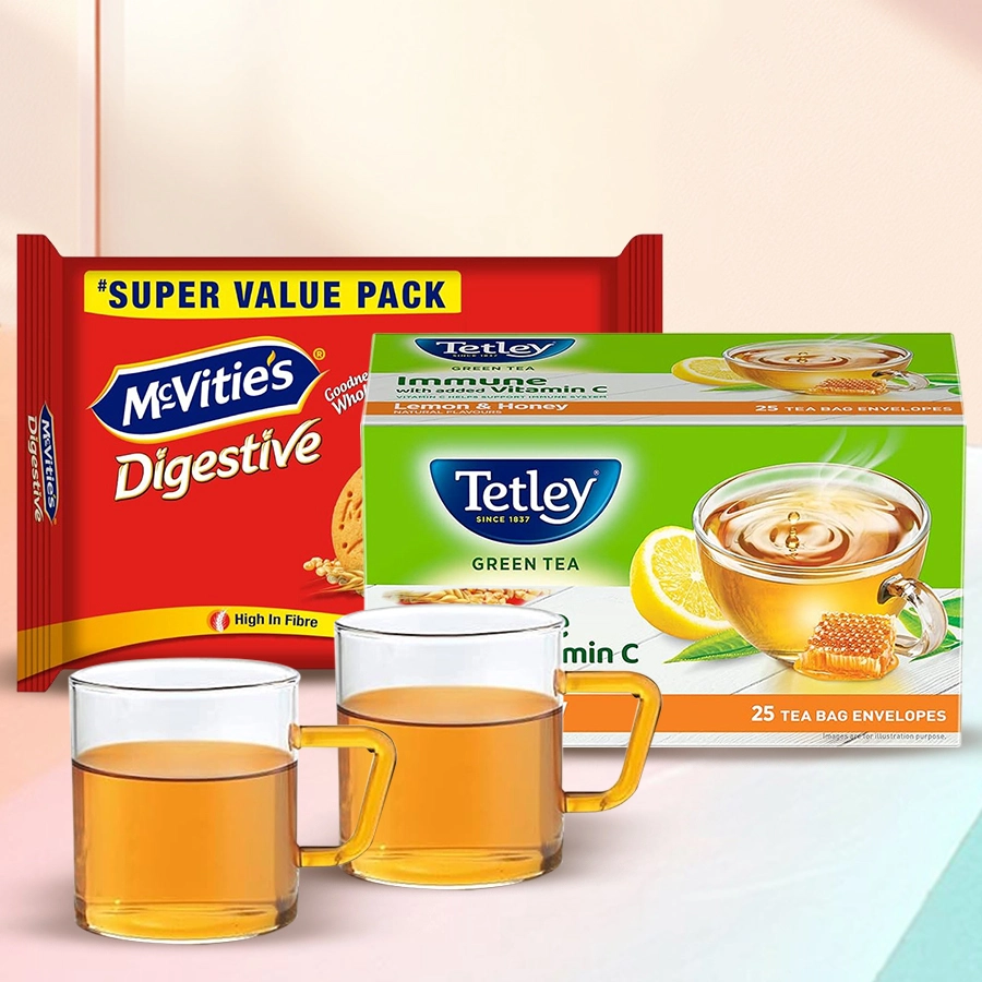Superb Green Tea Hamper featuring green tea, McVitie’s Digestive High Fibre Biscuits, and a Borosil mug.