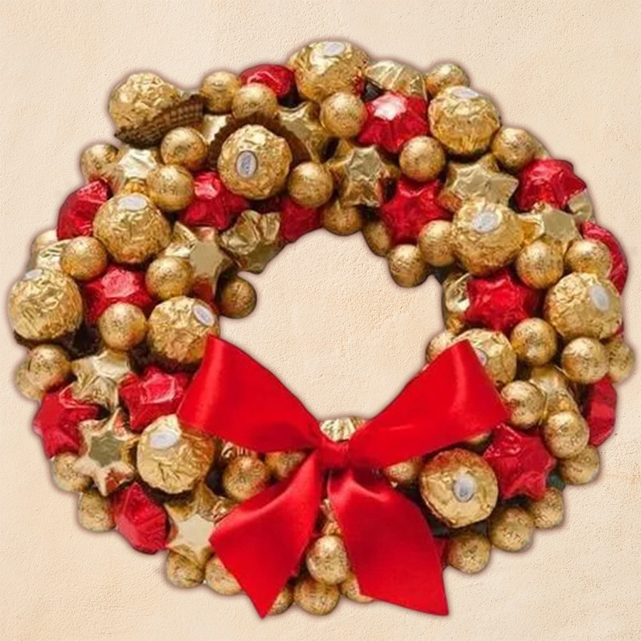 Elegant Christmas wreath made of handmade chocolates and Ferrero Rocher