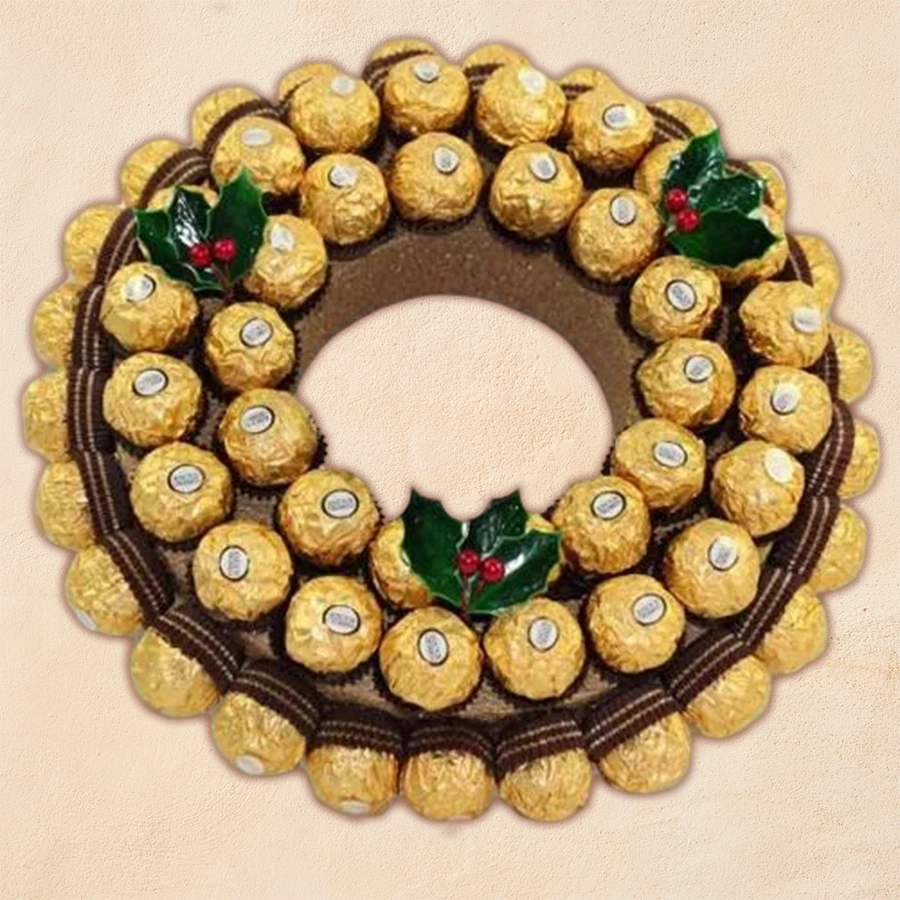 A Christmas wreath decorated with 48 Ferrero Rocher chocolates, showcasing a festive and elegant design.