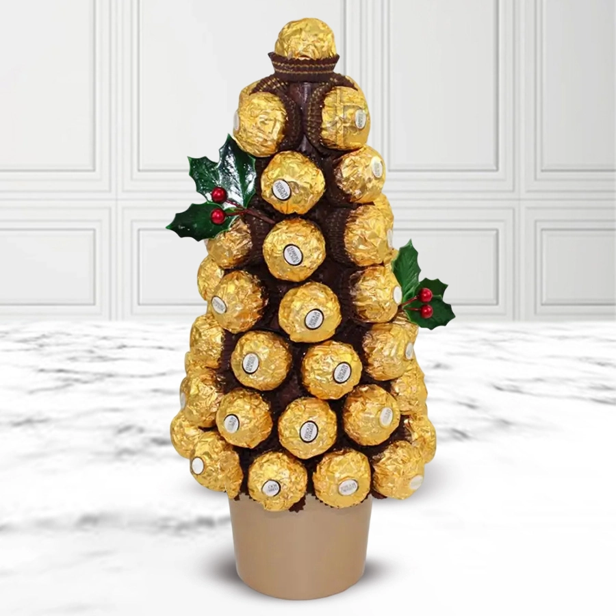 A beautifully crafted Christmas tree made of 36 Ferrero Rocher chocolates, adorned with festive decorations and presented in an elegant setting.