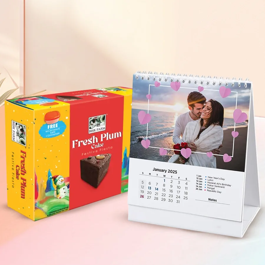 Personalized desk calendar with photographs and a plum cake, beautifully arranged as a Christmas gift.