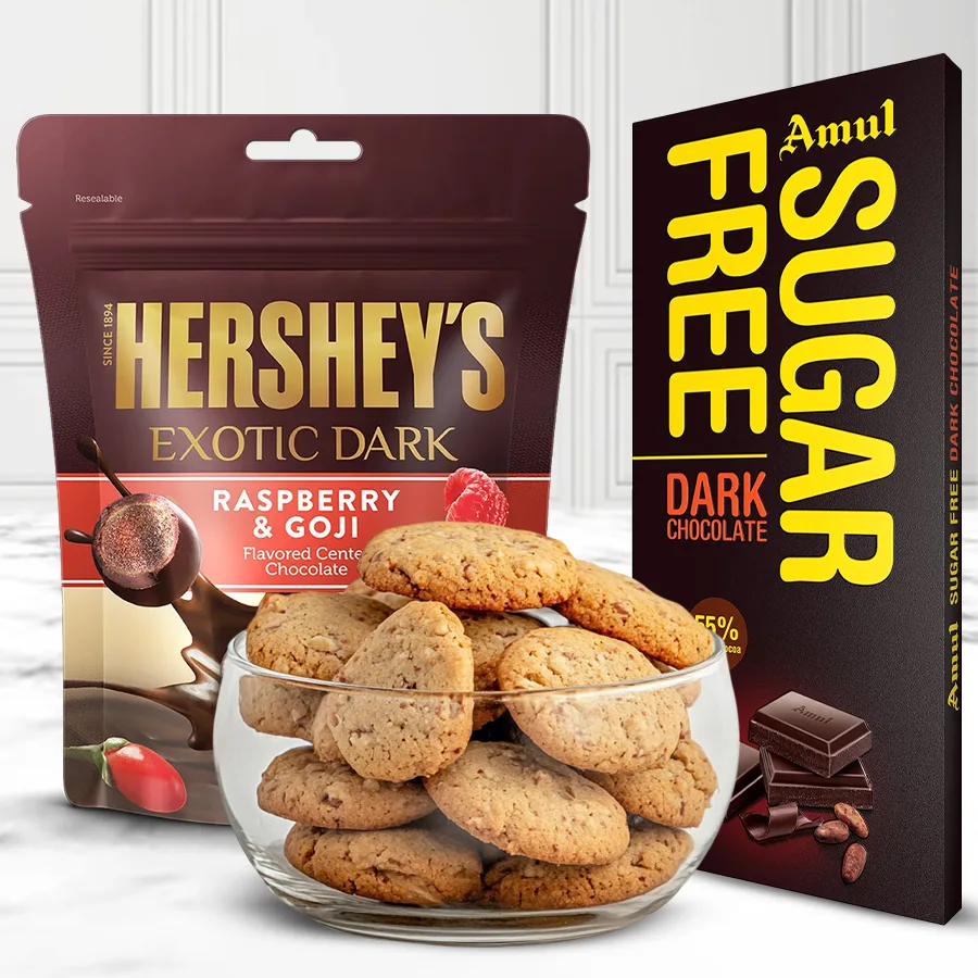 Gift set featuring Almond Protein Cookies, Sugar-Free Dark Chocolate, and Exotic Dark Raspberry & Goji Chocolate for Christmas.