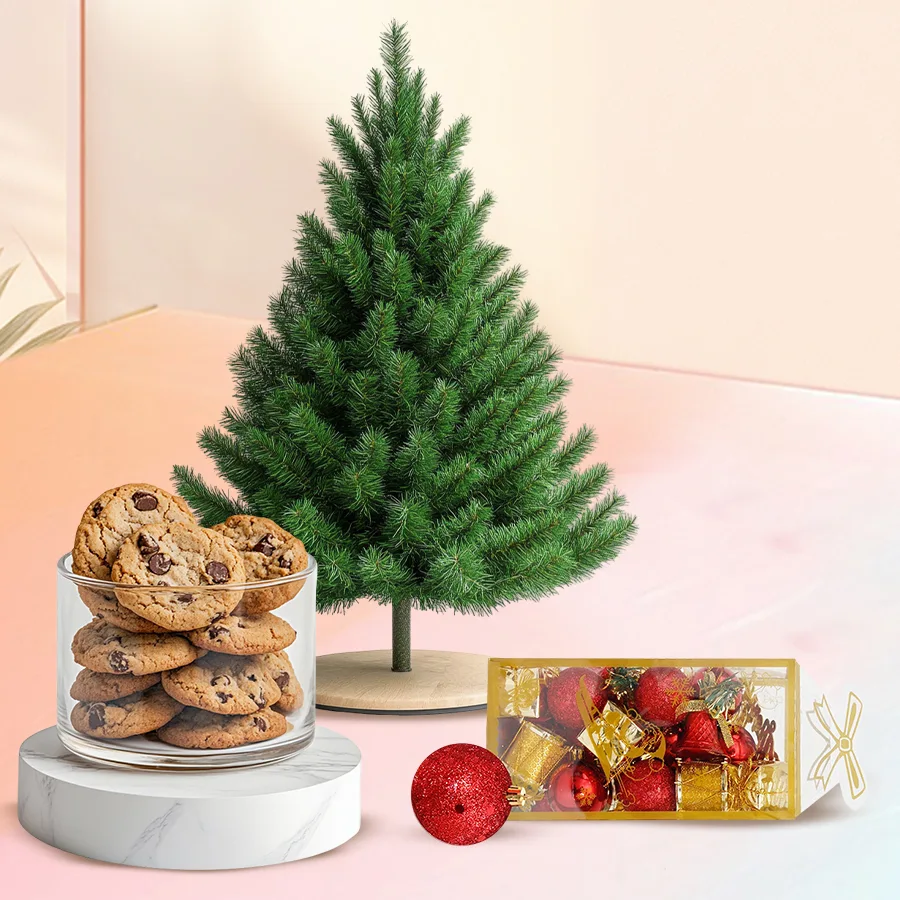 Ecstatic Xmas Decoration Gift Set featuring a lightweight artificial tree with mini ornaments, double chocolate chip cookies, and a black and silver metal crucifix bracelet.