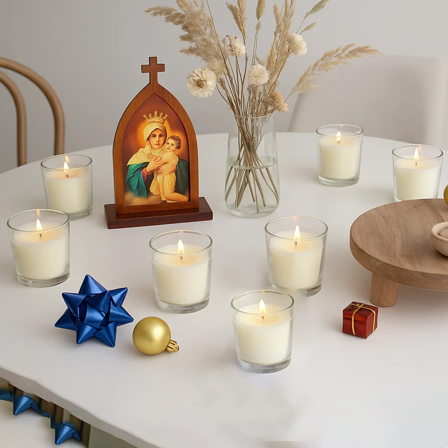 Acrylic sculpture of Jesus Christ on a cross with six unscented votive candles arranged beside it