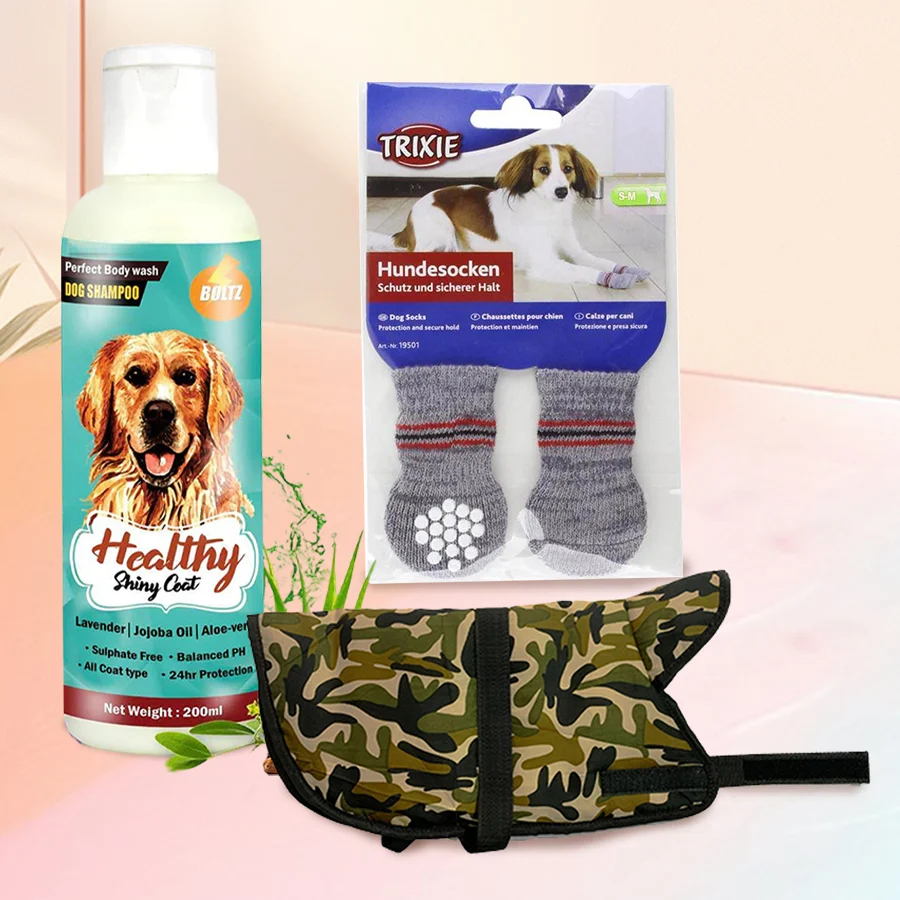 Elegant Xmas gift set for dogs featuring a bottle of dog shampoo, stylish grey non-slip socks, and a camouflage army-style hoodie vest.