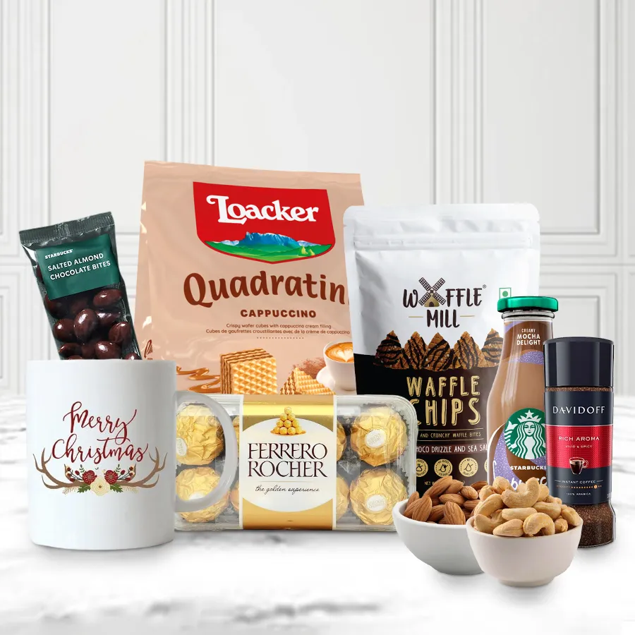 Refreshing Xmas Morning Delight Gift Combo featuring Ferrero Rocher chocolates, Loacker Cappuccino Wafers, Waffle Mill Chocolate Chips, Davidoff Instant Coffee, Starbucks Mocha, Salted Almond Bites, roasted almonds, cashews, and a festive Christmas coffee mug.