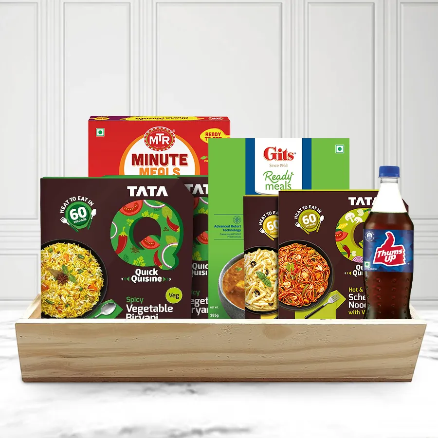 Ravishing Choice Veg Lunch Hamper featuring spicy veggie biryani, paneer tikka masala, chana masala, cheesy pasta with olives, Schezwan noodles, and a Thums Up, presented on a wooden tray.