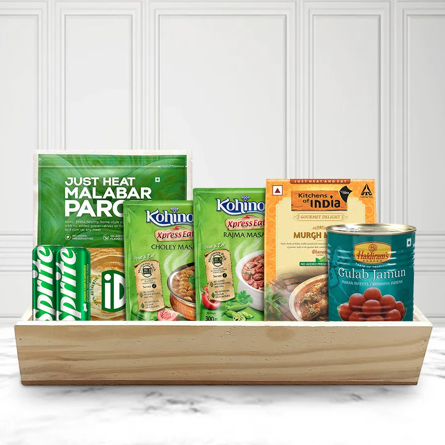 Superb Selection Non-Veg Lunch Hamper with Malabar Parota, Kohinoor masalas, Kitchens of India Murgh Methi, Haldiram Gulab Jamun, Sprite, and a wooden tray, displayed for Christmas celebrations.