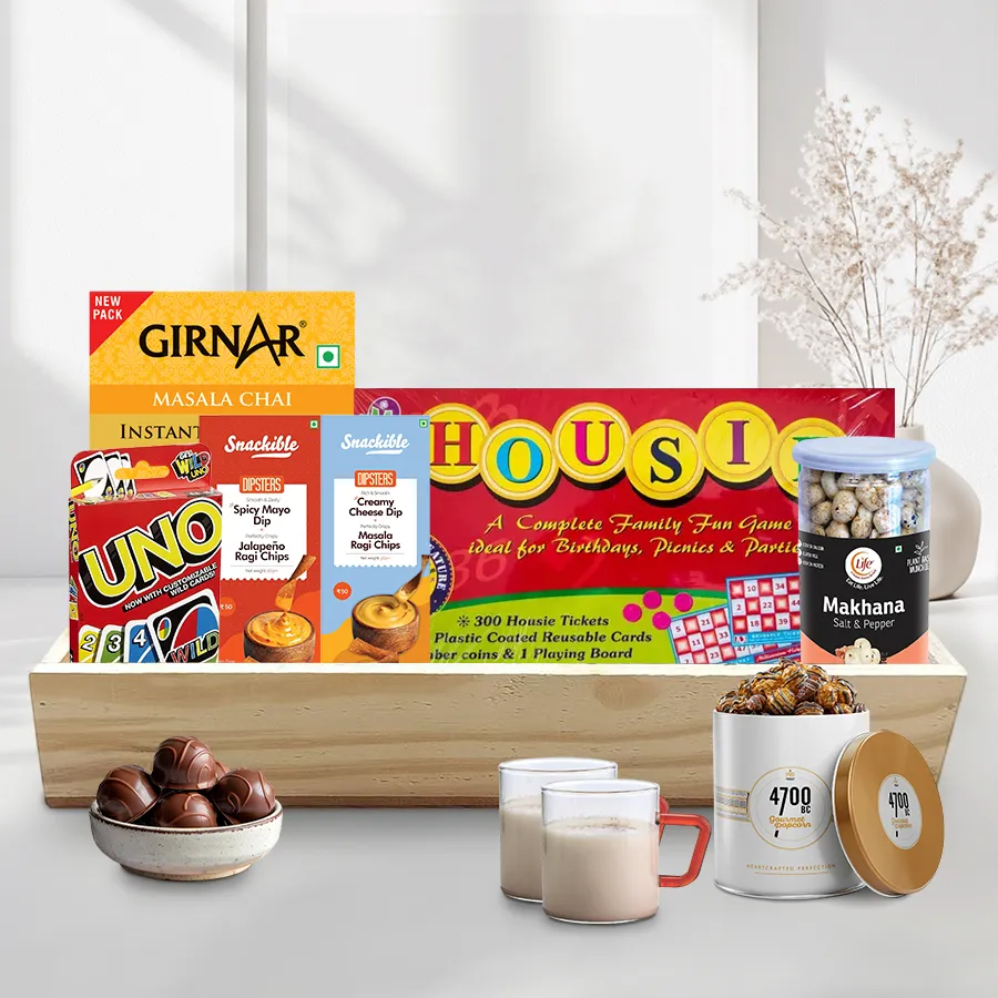 Impressive Xmas Evening Gala Snacks Hamper featuring gourmet snacks, stylish mugs, games, and a wooden tray