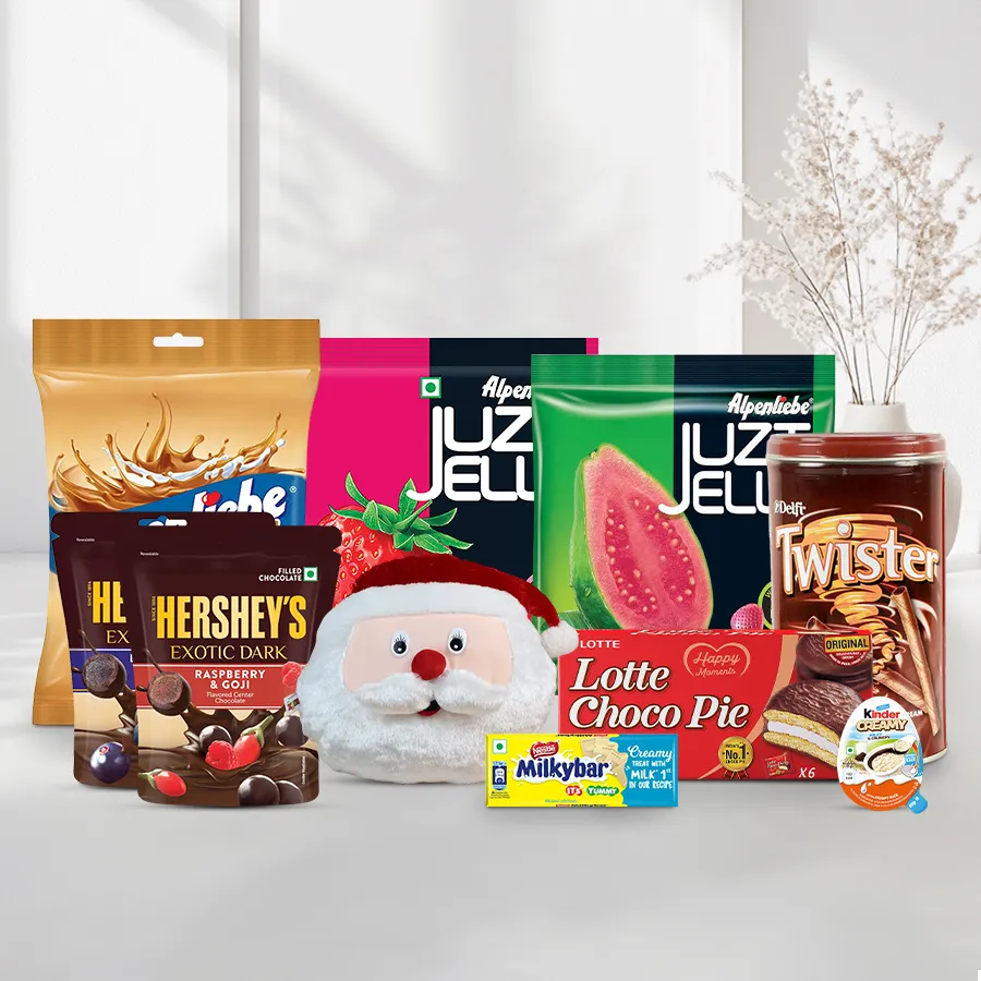Xmas Chocolate and Wafers Hamper for Kids featuring a Santa Claus cushion and various treats like Hershey’s chocolates, Kinder bars, Delfi wafers, Alpenliebe jellies, caramel candies, Lotte Choco Pies, and Nestle Milk Bars.