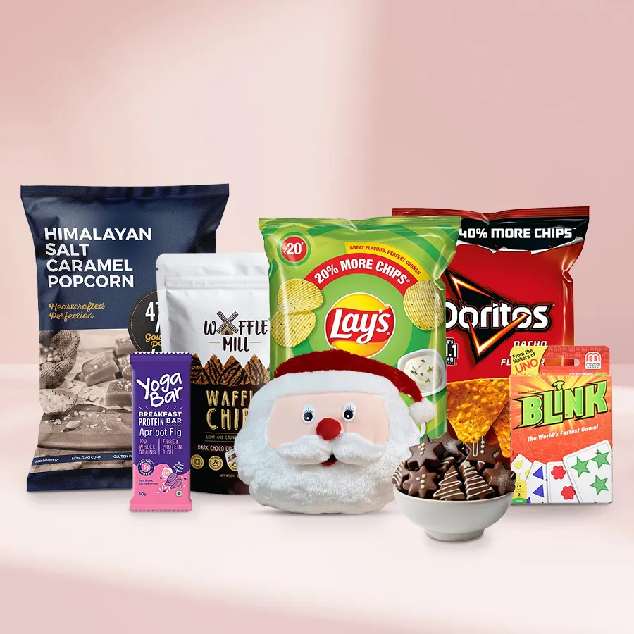 Deluxe Chocolate Bites Xmas Gift Basket featuring handmade chocolates, popcorn, chips, a Yoga Protein Bar, and Mattel game set.