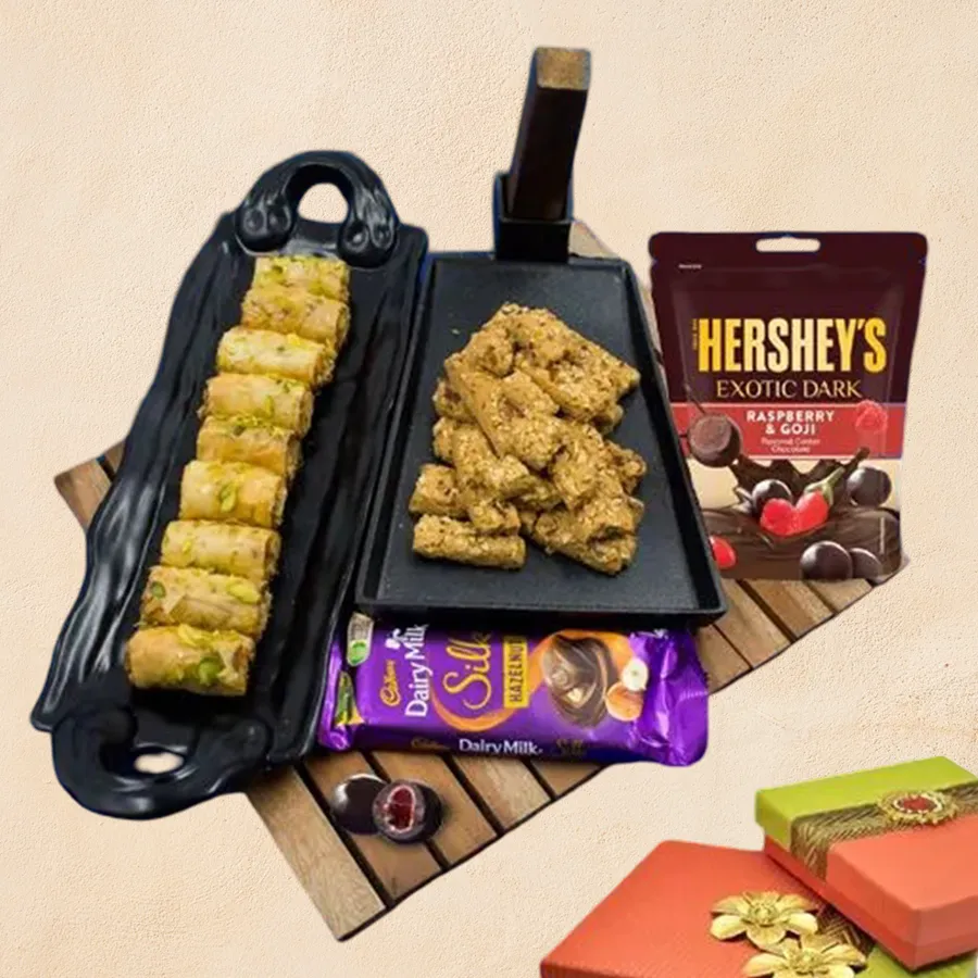 Delicious Baklava and Chocolates Gift Combo featuring almond sticks, roll baklava, Cadbury Dairy Milk Silk Hazelnut, and Hershey’s Exotic Dark Raspberry & Goji