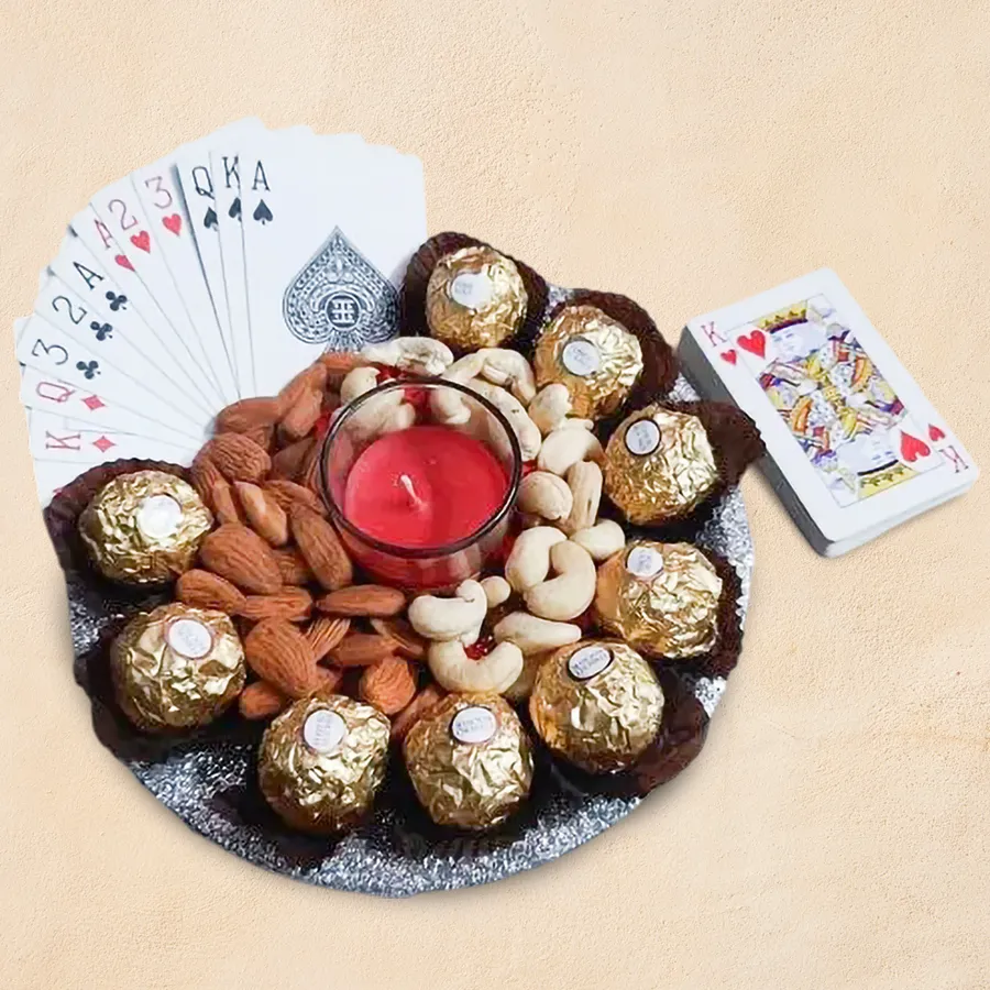 Sensational Evening Party Gift Tray featuring Ferrero Rocher, cashews, almonds, playing cards, aroma shot candles on a decorative plate