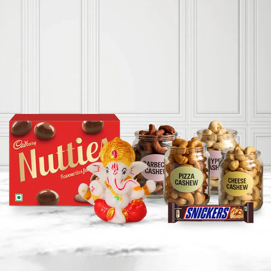 Fabulous Marble Ganpati Gift Combo featuring a marble Ganpati idol, assorted chocolates, and flavored cashews