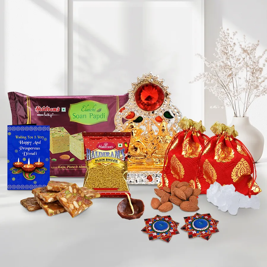 Magical Diwali Dhamaaka Sweets and Dry Fruits Gift Box with Haldiram’s Soan Papdi, crispy Bhujia, Dry Fruit Chikki, almond and mishri potlis, chocolate and dot mandala Diyas, Ganesh Lakshmi Mandap, and a Diwali card